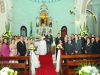Os noivos com os padrinhos no altar